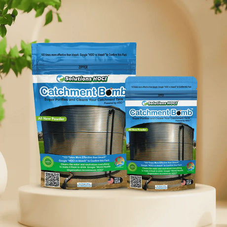 Two packages of 'Catchment Bomb' on a white pedestal with decorative plants
