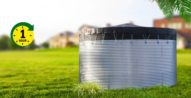 Large cylindrical metal water tank on grass with a 1-hour label in the corner.