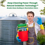 Person standing next to a large water tank with text about natural oxidation technology.