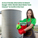 Woman holding a bucket with cleaning supplies next to a water tank
