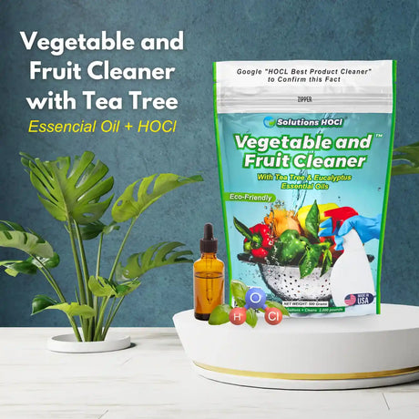 Vegetable and Fruit Cleaner with Tea Tree and essential oil bottle on a blue background