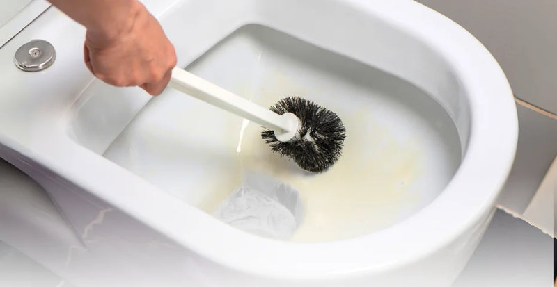 Cleaning toilet bomb using scrub